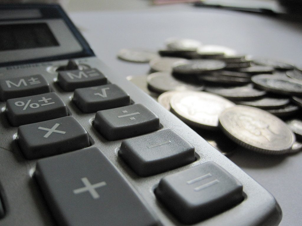 A calculator resting on Korean banknotes on a desk